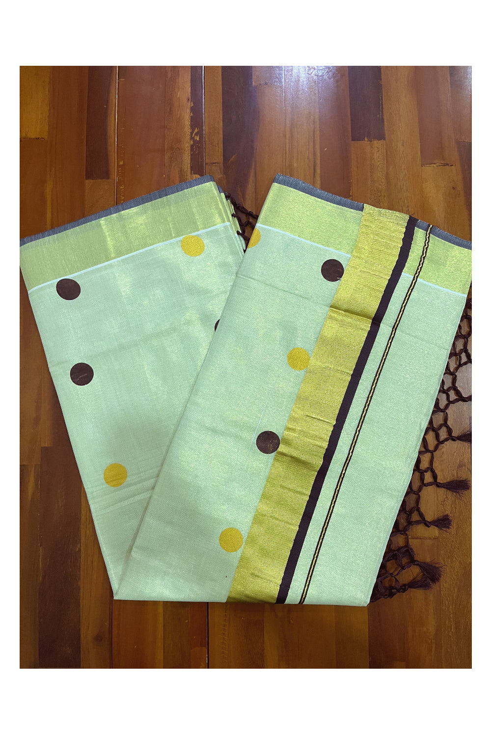 Kerala Tissue Kasavu Saree with Brown and Golden Polka Prints and Tassels Works