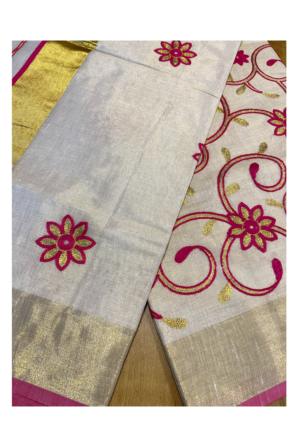 Kerala Tissue Kasavu Saree With Pink and Golden Floral Embroidery Works