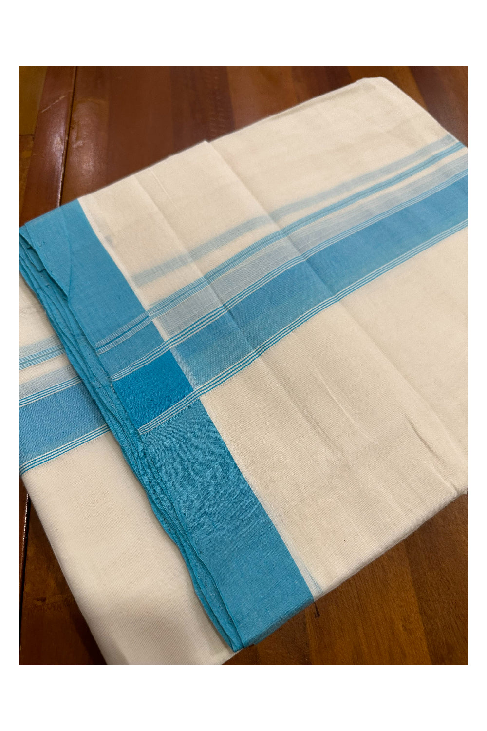 Southloom Premium Handloom Mundu with Turquoise Kara (Onam Mundu 2023)