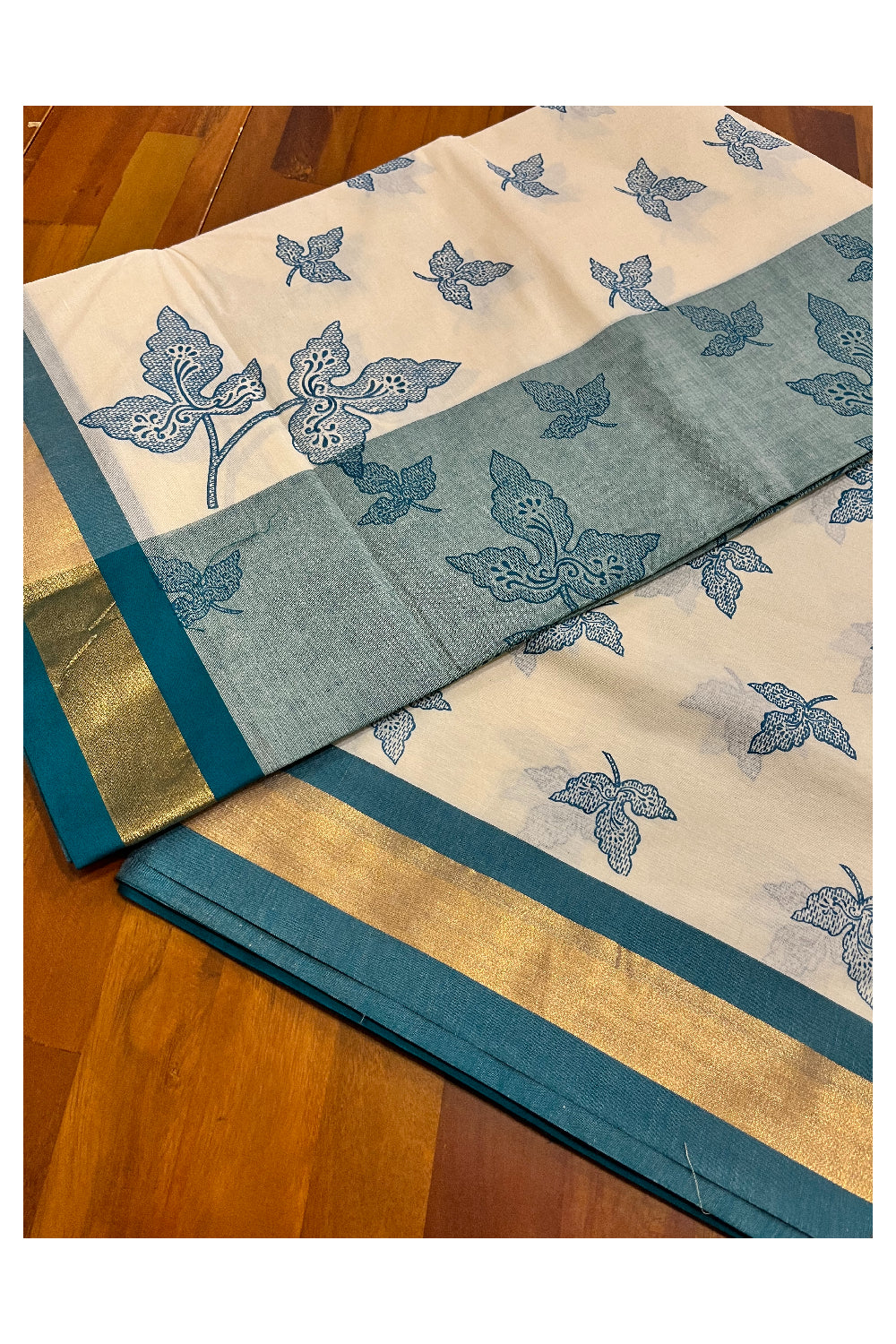 Pure Cotton Kerala Saree with Teal Block Print Leaf Designs and Kasavu Border (Vishu 2024 Collection)