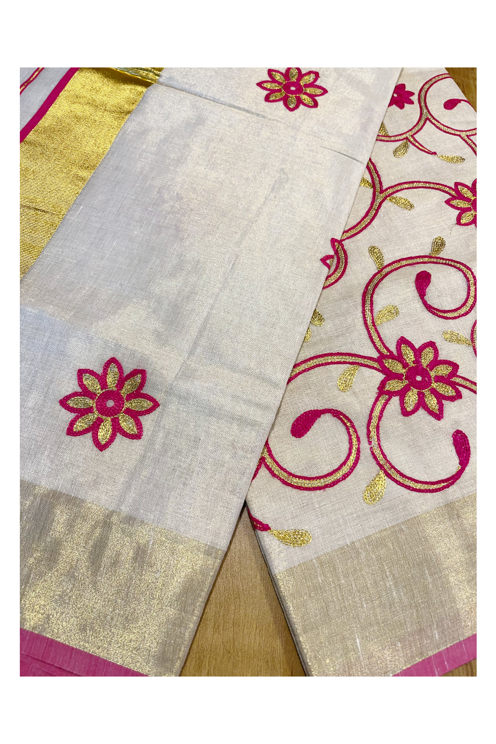 Kerala Tissue Kasavu Saree With Pink and Golden Floral Embroidery Works