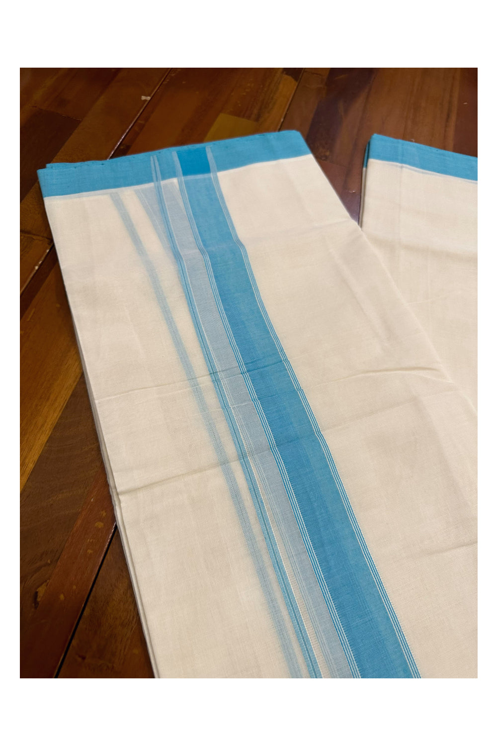 Southloom Premium Handloom Mundu with Turquoise Kara (Onam Mundu 2023)