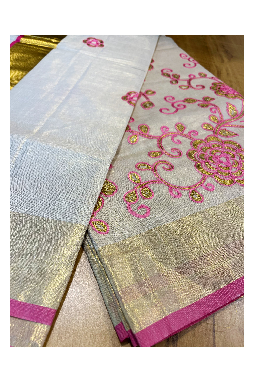 Kerala Tissue Kasavu Saree With Pink and Golden Floral Embroidery Works