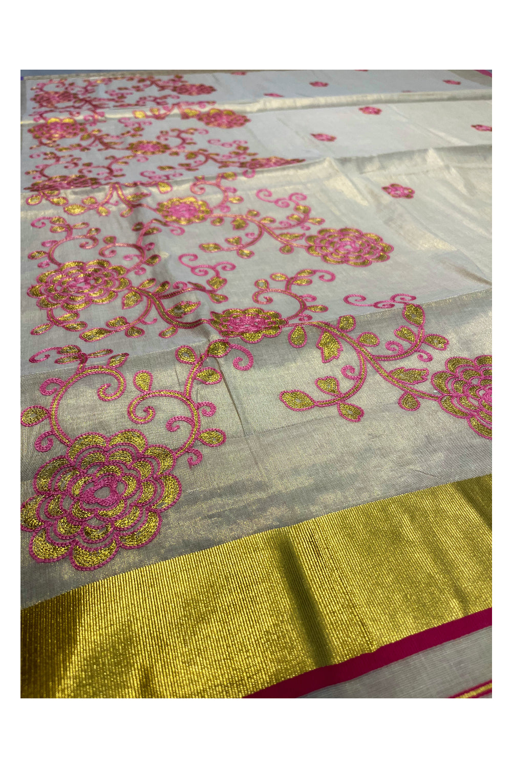 Kerala Tissue Kasavu Saree With Pink and Golden Floral Embroidery Works