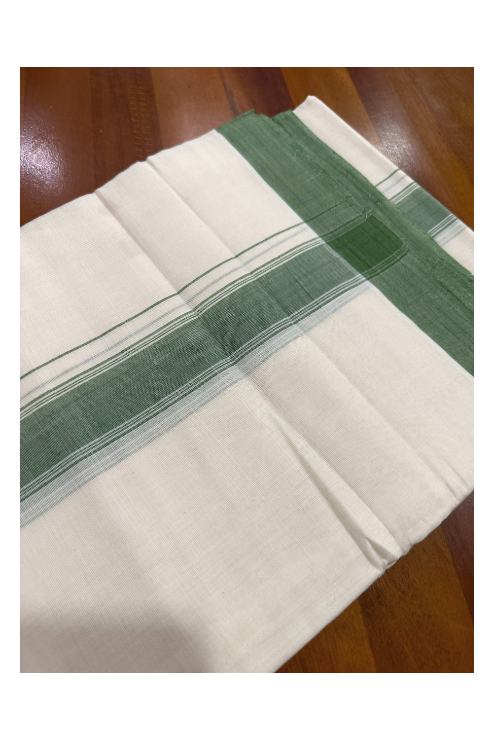 Southloom Premium Handloom Mundu with Green Kara (Onam Mundu 2023)