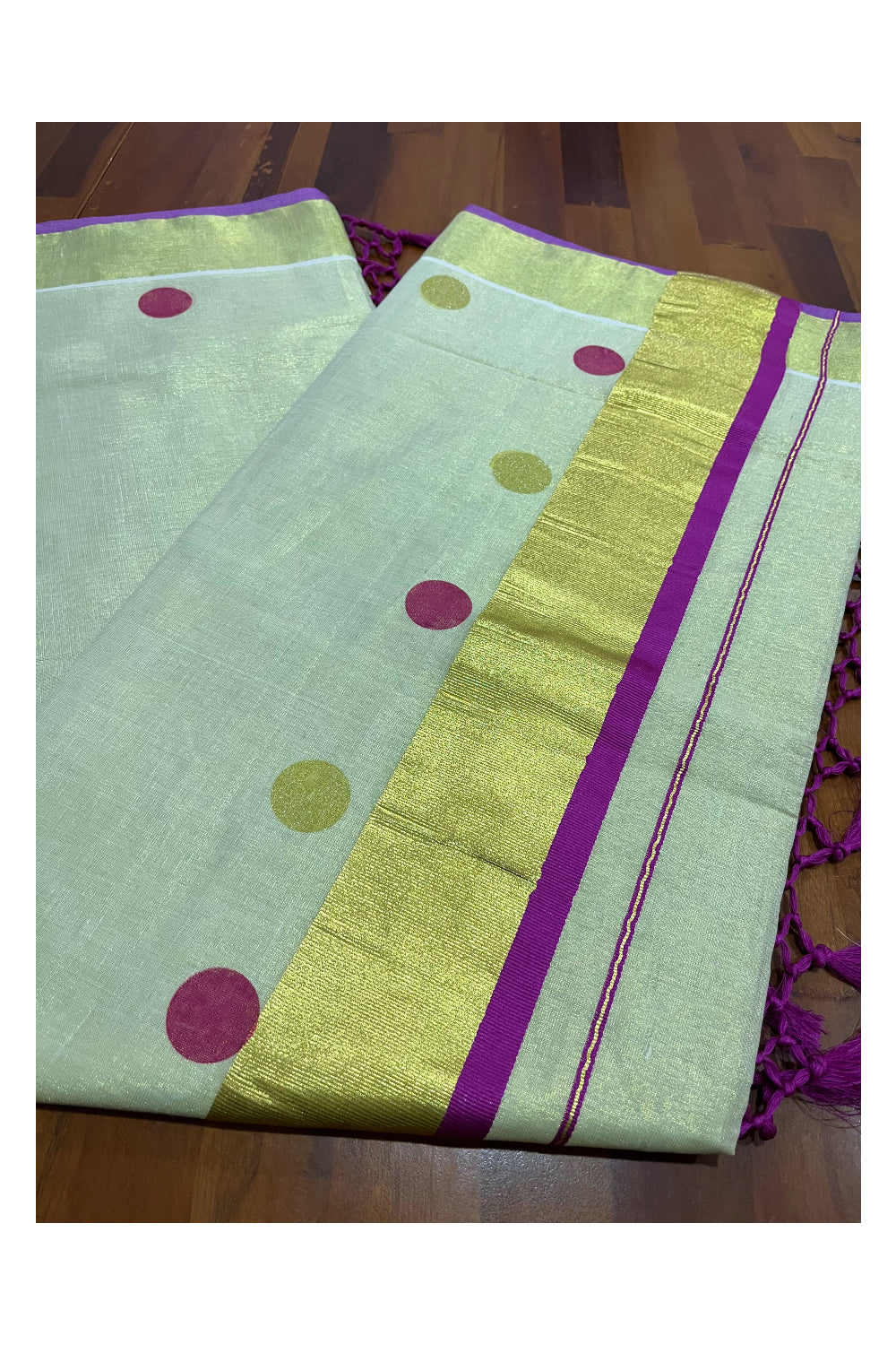 Kerala Tissue Kasavu Saree with Magenta and Golden Polka Prints and Tassels Works