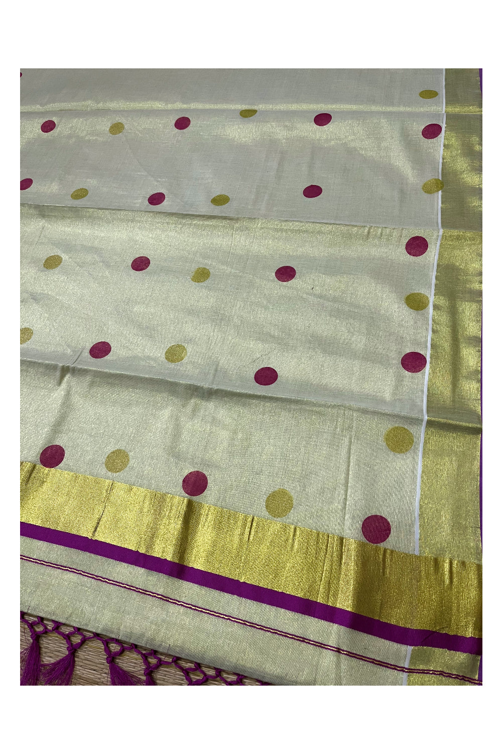 Kerala Tissue Kasavu Saree with Magenta and Golden Polka Prints and Tassels Works