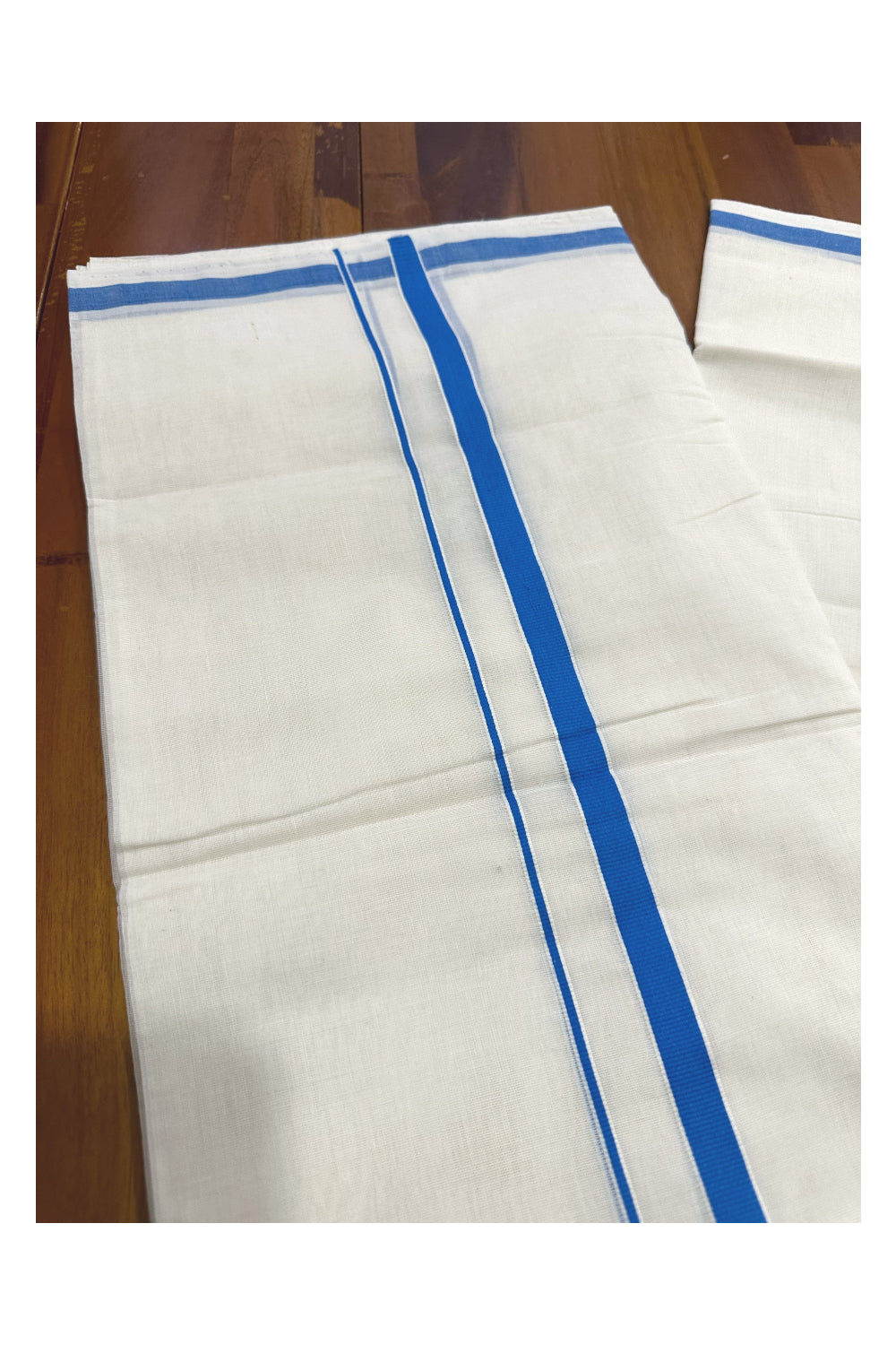 Southloom Premium Handloom Mundu with Blue Kara (Onam Mundu 2023)