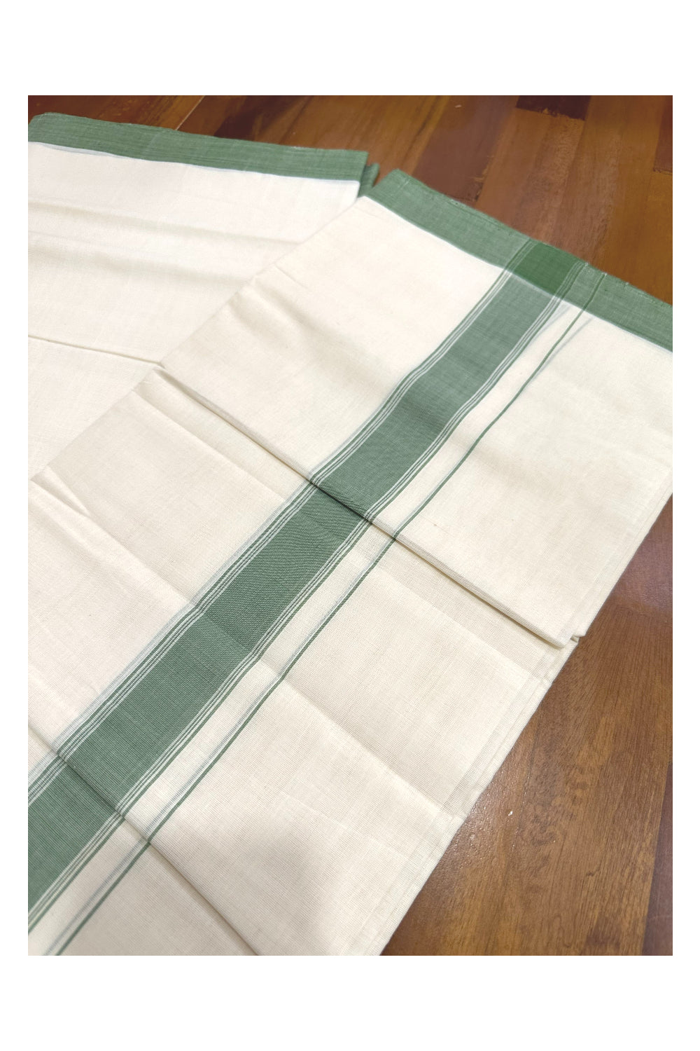 Southloom Premium Handloom Mundu with Green Kara (Onam Mundu 2023)