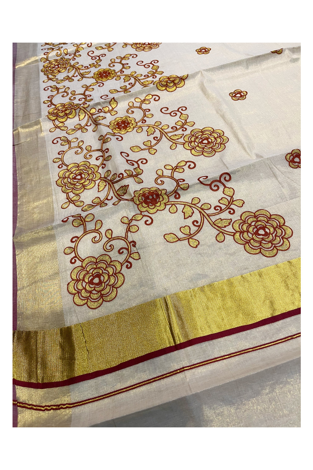 Kerala Tissue Kasavu Saree With Brown and Golden Floral Embroidery Works