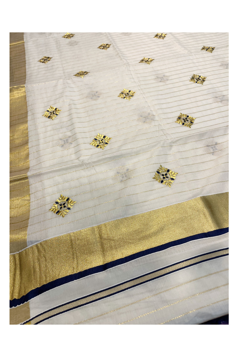 Kerala Cotton Kasavu Lines Saree with Blue and Golden Floral Embroidery Work