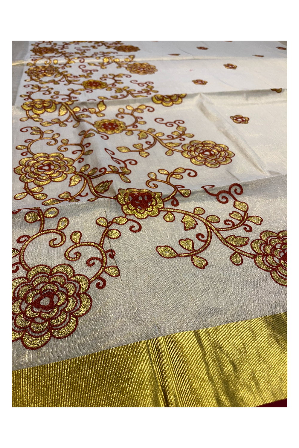 Kerala Tissue Kasavu Saree With Brown and Golden Floral Embroidery Works