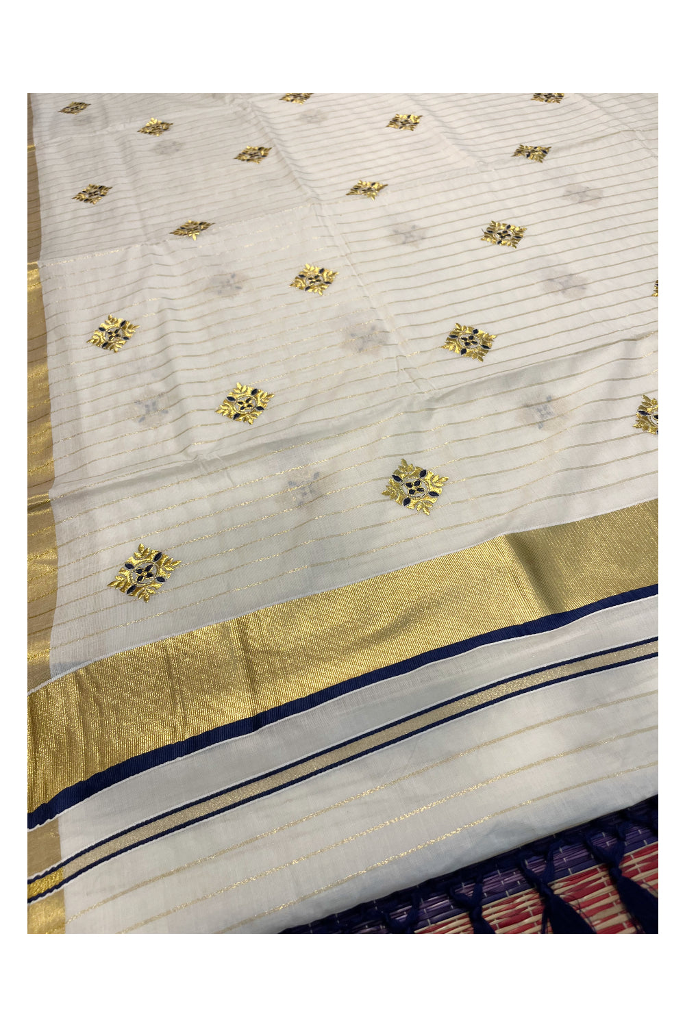 Kerala Cotton Kasavu Lines Saree with Blue and Golden Floral Embroidery Work