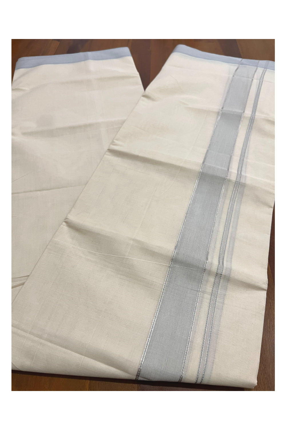 Pure Cotton 100x100 Double Mundu with Silver Kasavu and Pastel Blue Kara (Onam Mundu 2023)