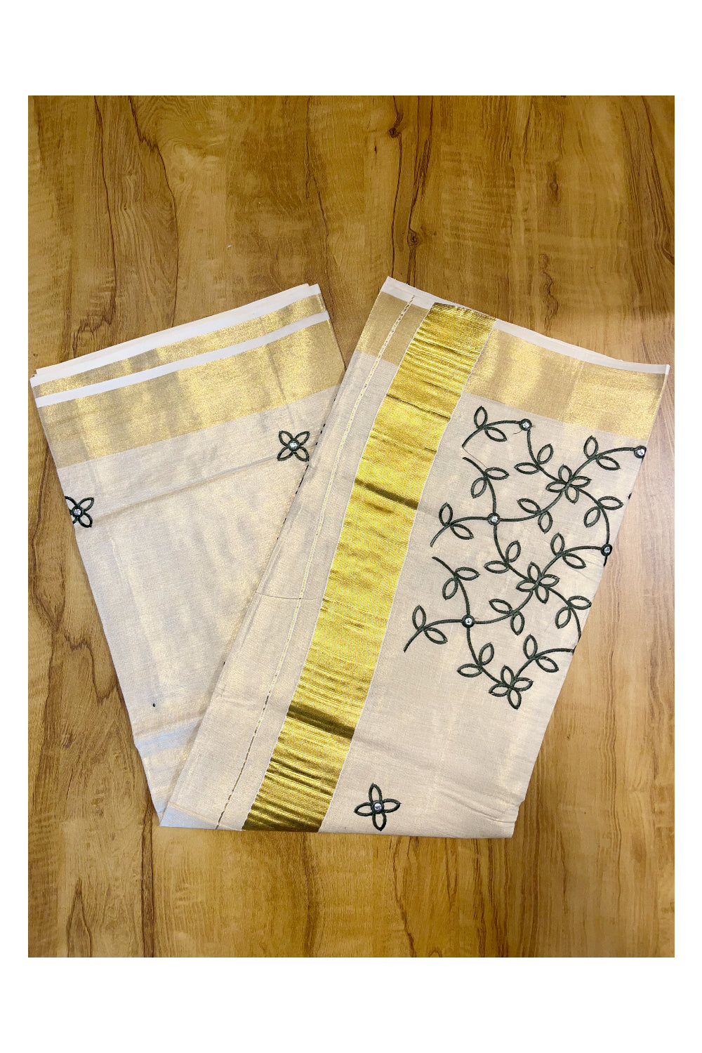 Kerala Tissue Kasavu Saree With Green Floral Embroidery Works