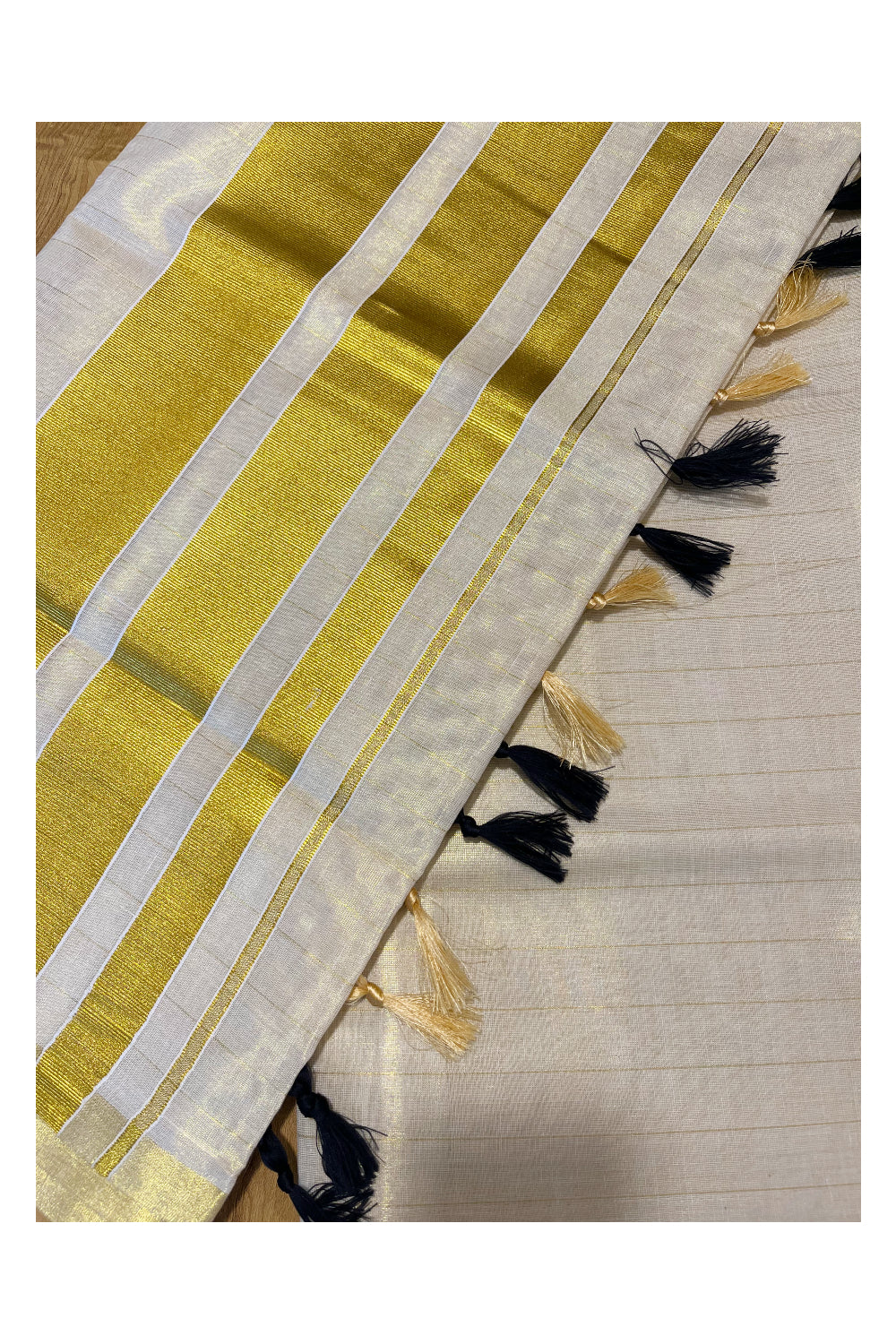 Kerala Tissue Lines Kasavu Saree with Black Tassels Work