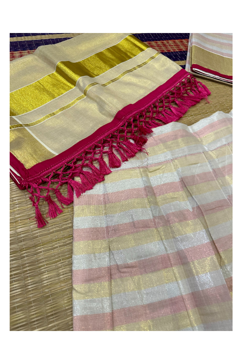 Semi Stitched Dhavani Set with Pink and Kasavu Lines Design Pavada and Blouse Piece