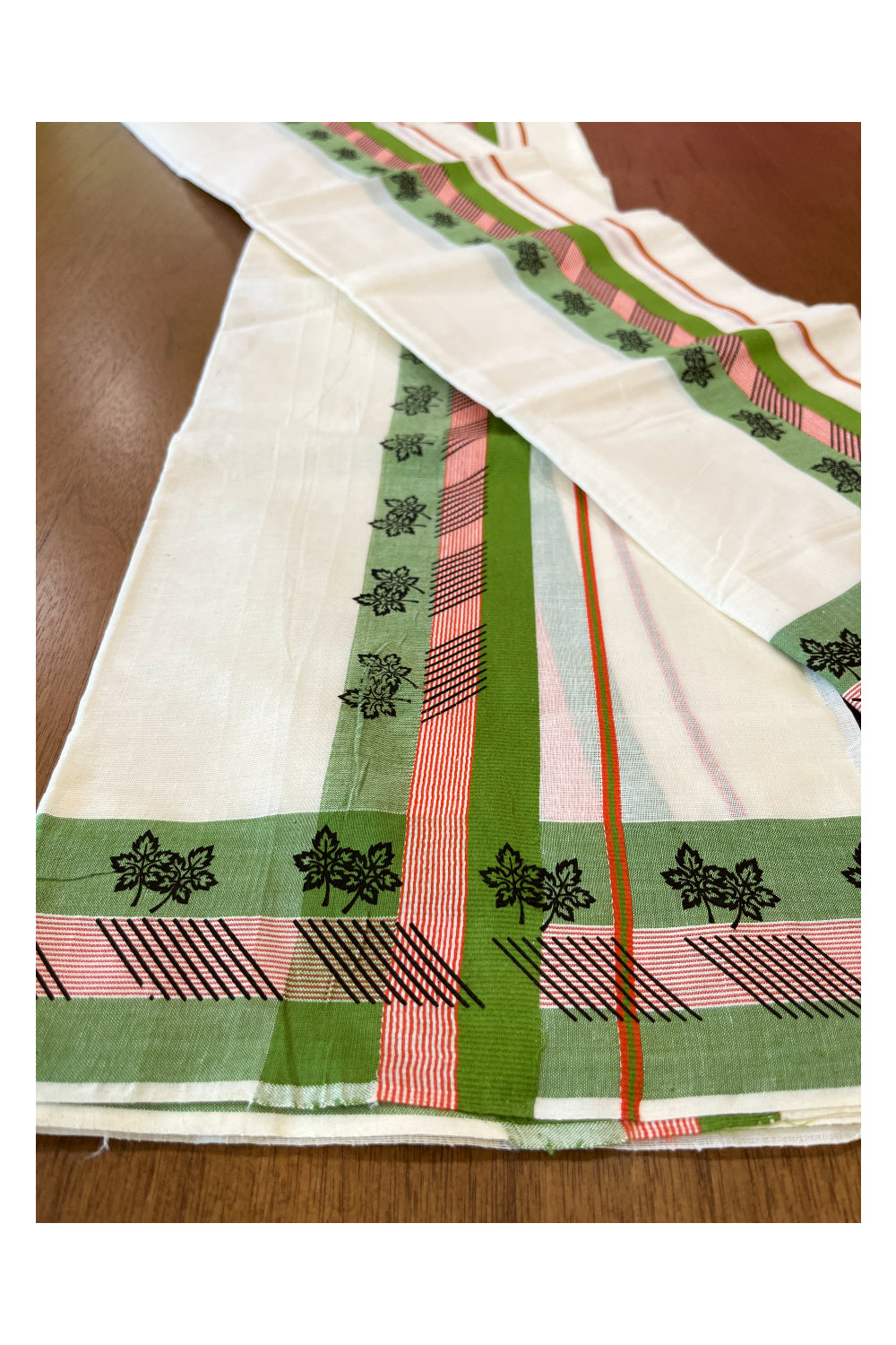 Cotton Single Set Mundu (Mundu Neriyathum) with Black Block Prints on Green Border