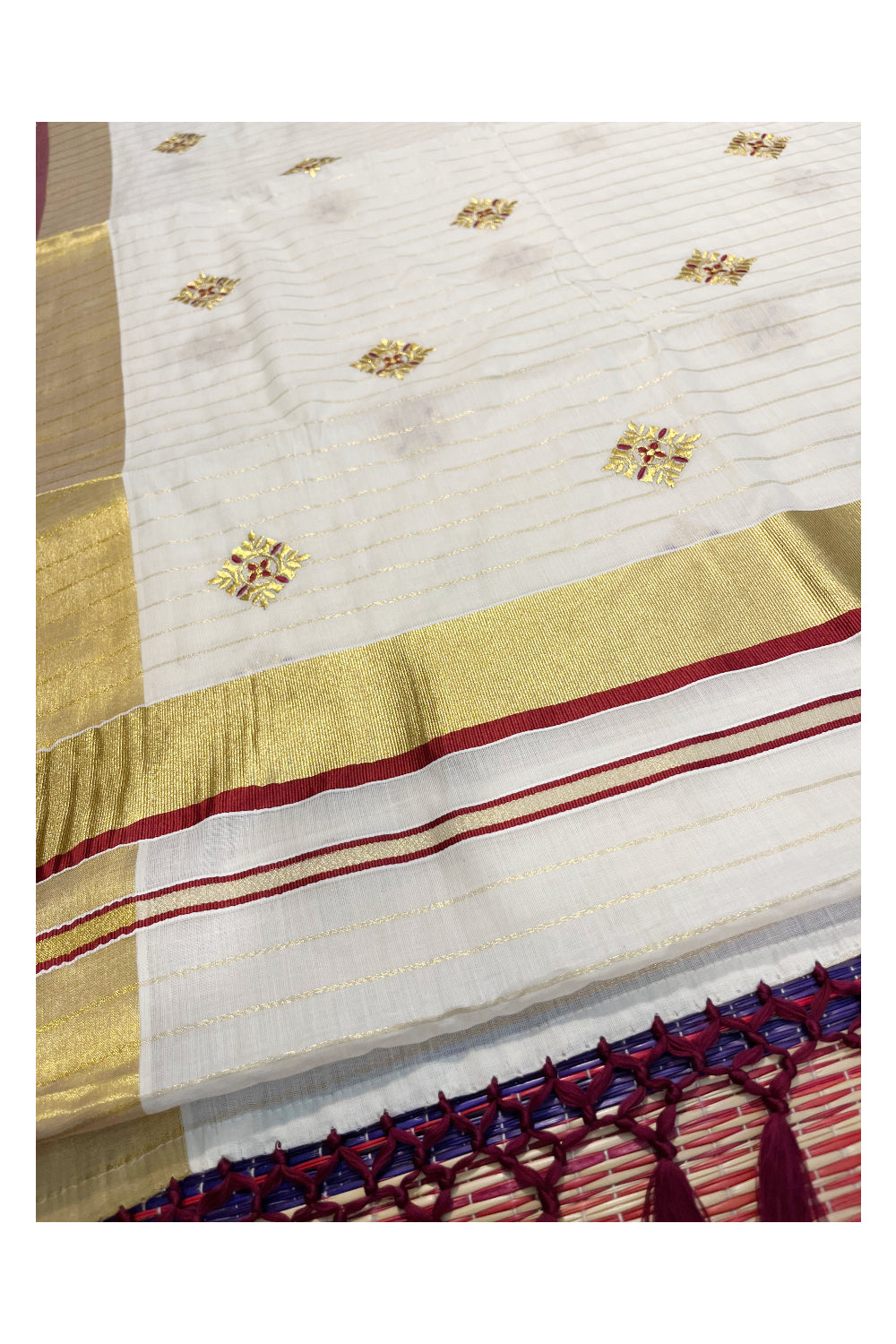 Kerala Cotton Kasavu Lines Saree with Maroon and Golden Floral Embroidery Work