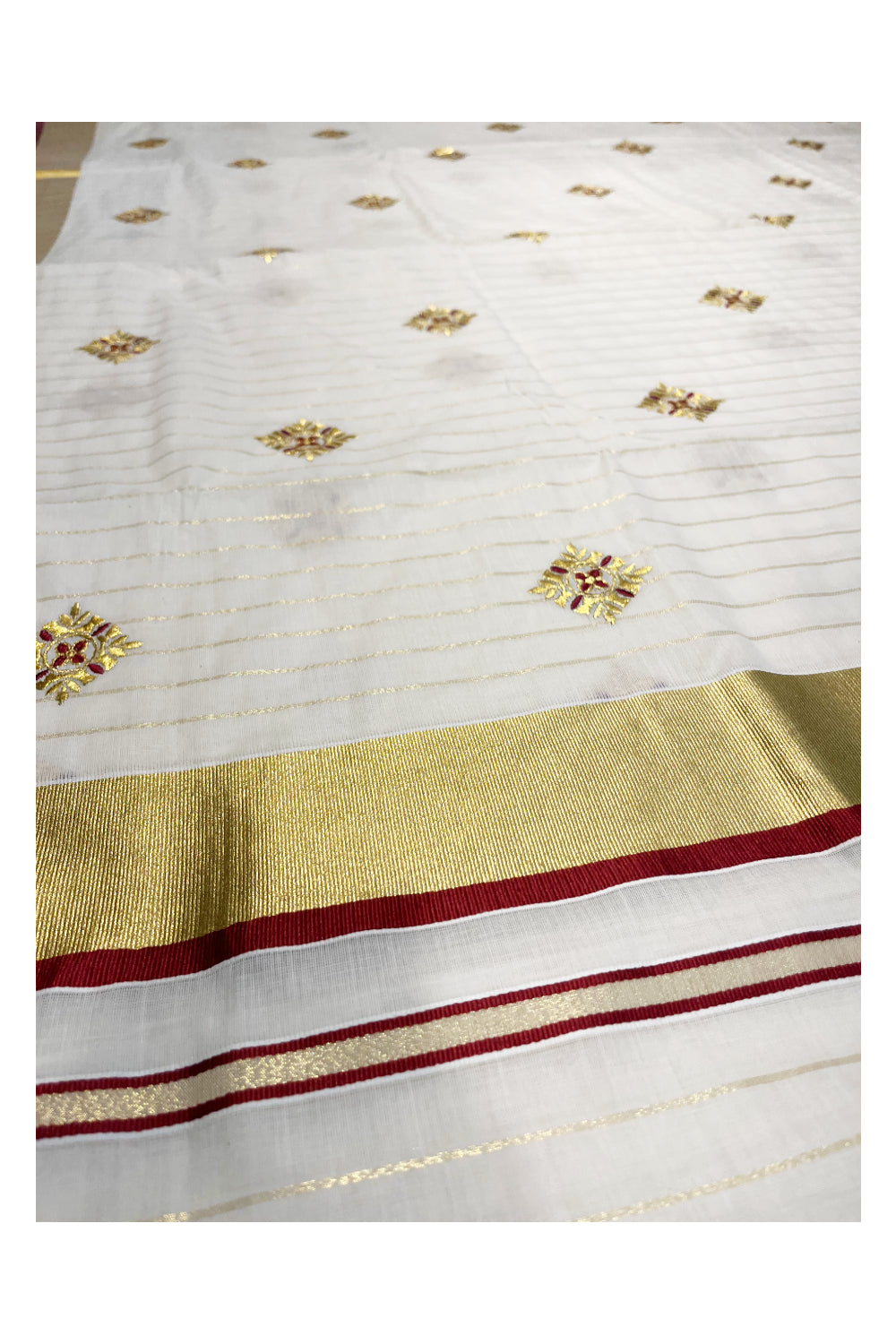 Kerala Cotton Kasavu Lines Saree with Maroon and Golden Floral Embroidery Work