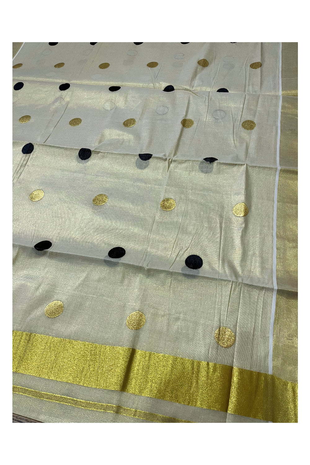 Kerala Tissue Kasavu Saree with Black Polka Woven Designs