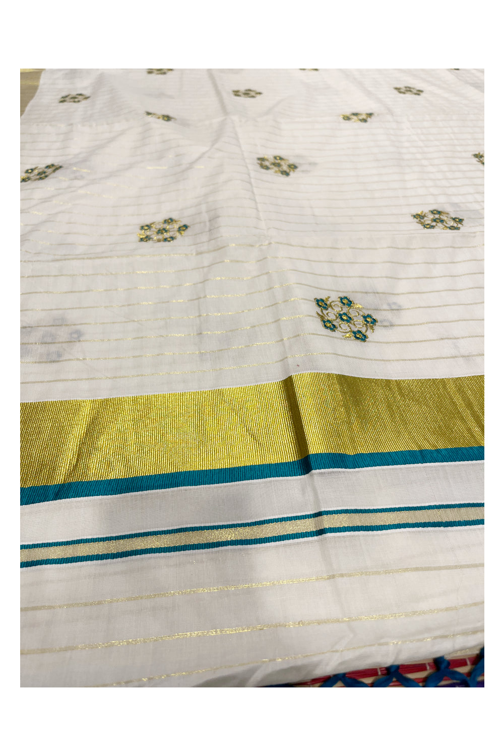 Kerala Cotton Kasavu Lines Saree with Peacock Green and Golden Floral Embroidery Work