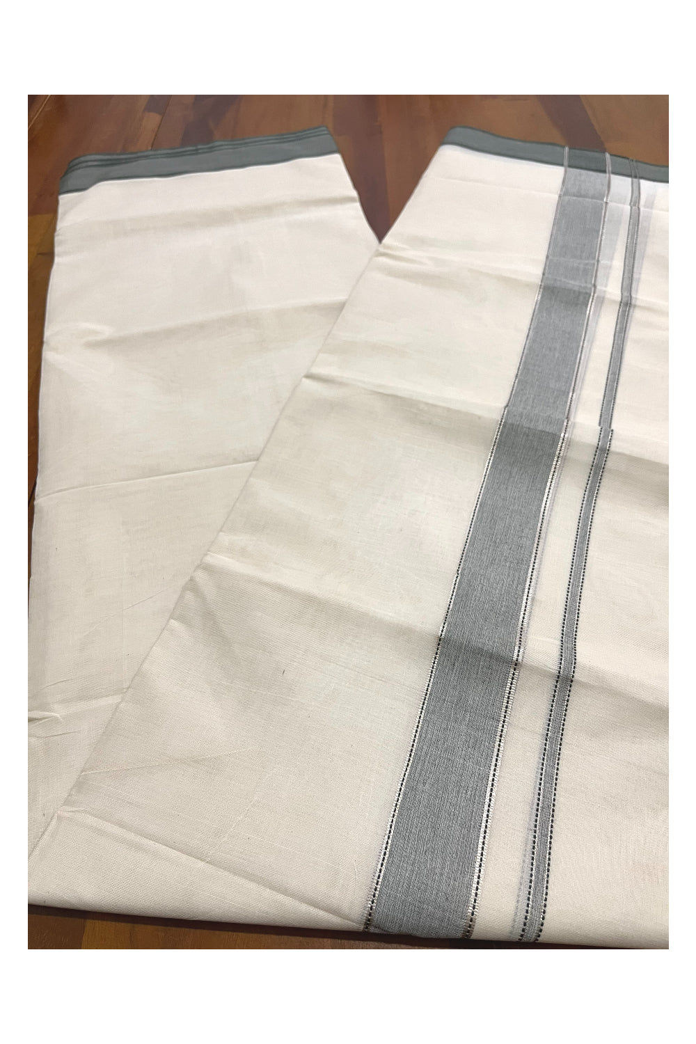 Pure Cotton 100x100 Double Mundu with Silver Kasavu and Dark Green Kara (Onam Mundu 2023)