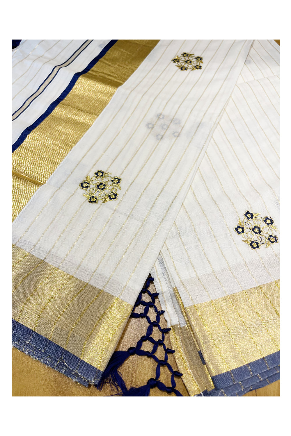 Kerala Cotton Kasavu Lines Saree with Blue and Golden Floral Embroidery Work