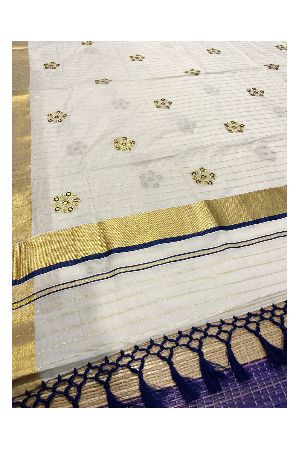 Kerala Cotton Kasavu Lines Saree with Blue and Golden Floral Embroidery Work