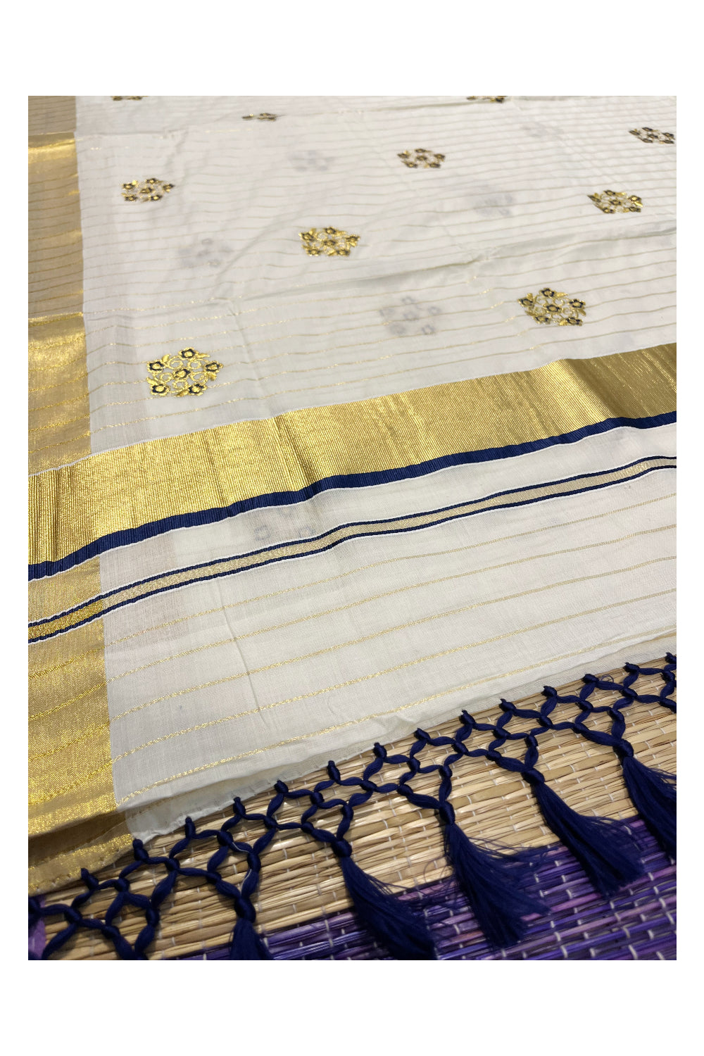 Kerala Cotton Kasavu Lines Saree with Blue and Golden Floral Embroidery Work