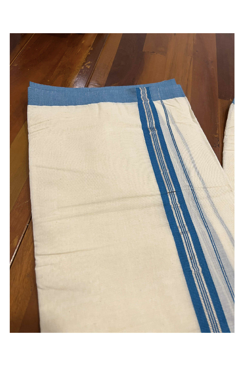 Off White Cotton Mundu with Teal Blue and Silver Kasavu Border (South Indian Dhoti)