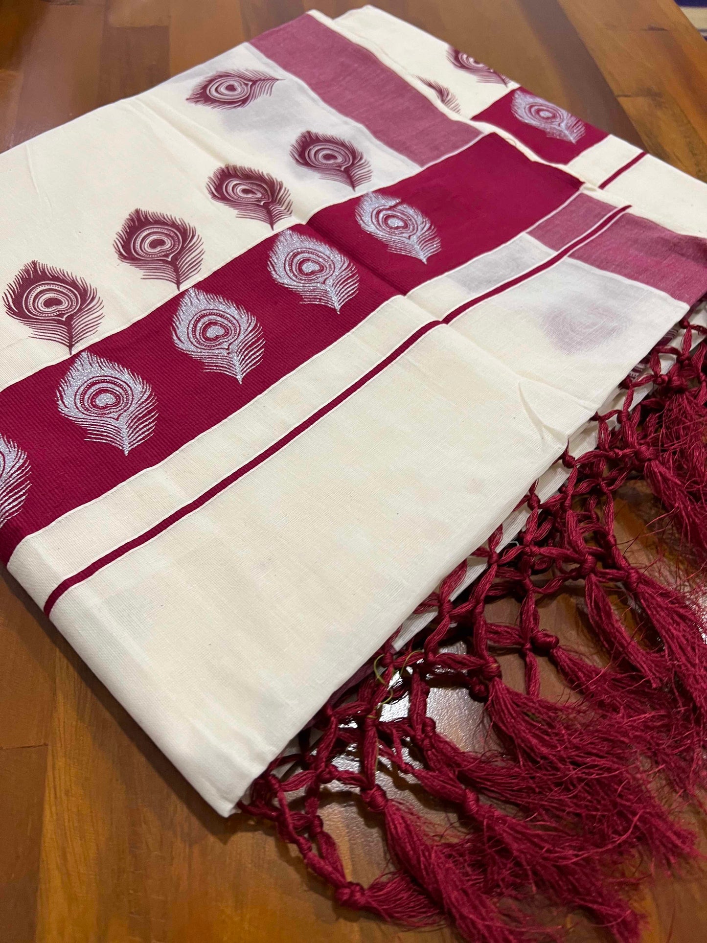 Off White Pure Cotton Kerala Saree with Peacock Feather Block Prints on Maroon Border and Tassels on Pallu