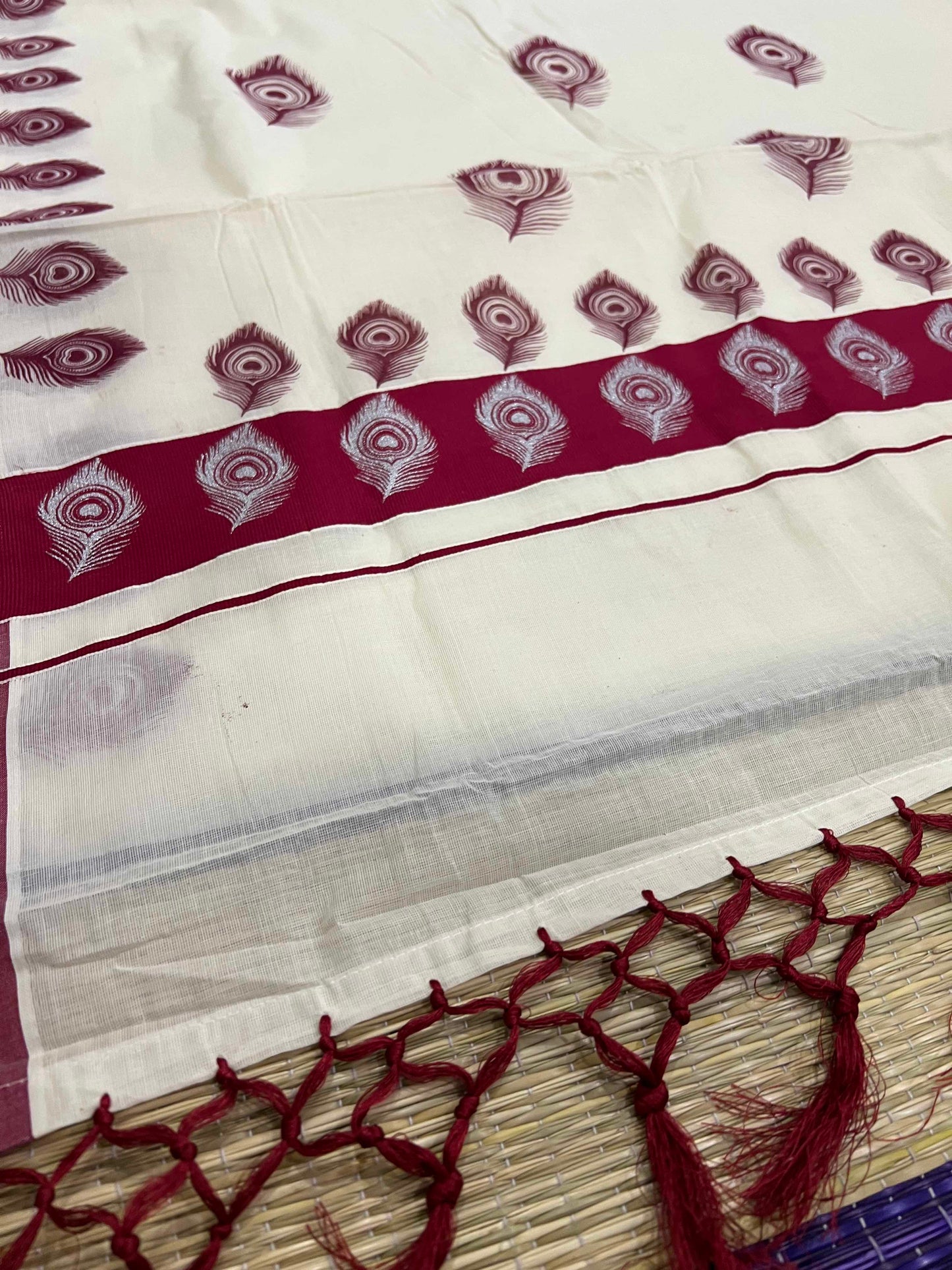 Off White Pure Cotton Kerala Saree with Peacock Feather Block Prints on Maroon Border and Tassels on Pallu