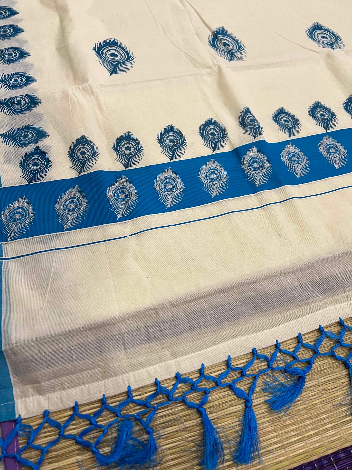 Off White Pure Cotton Kerala Saree with Peacock Feather Block Prints on Blue Border and Tassels on Pallu