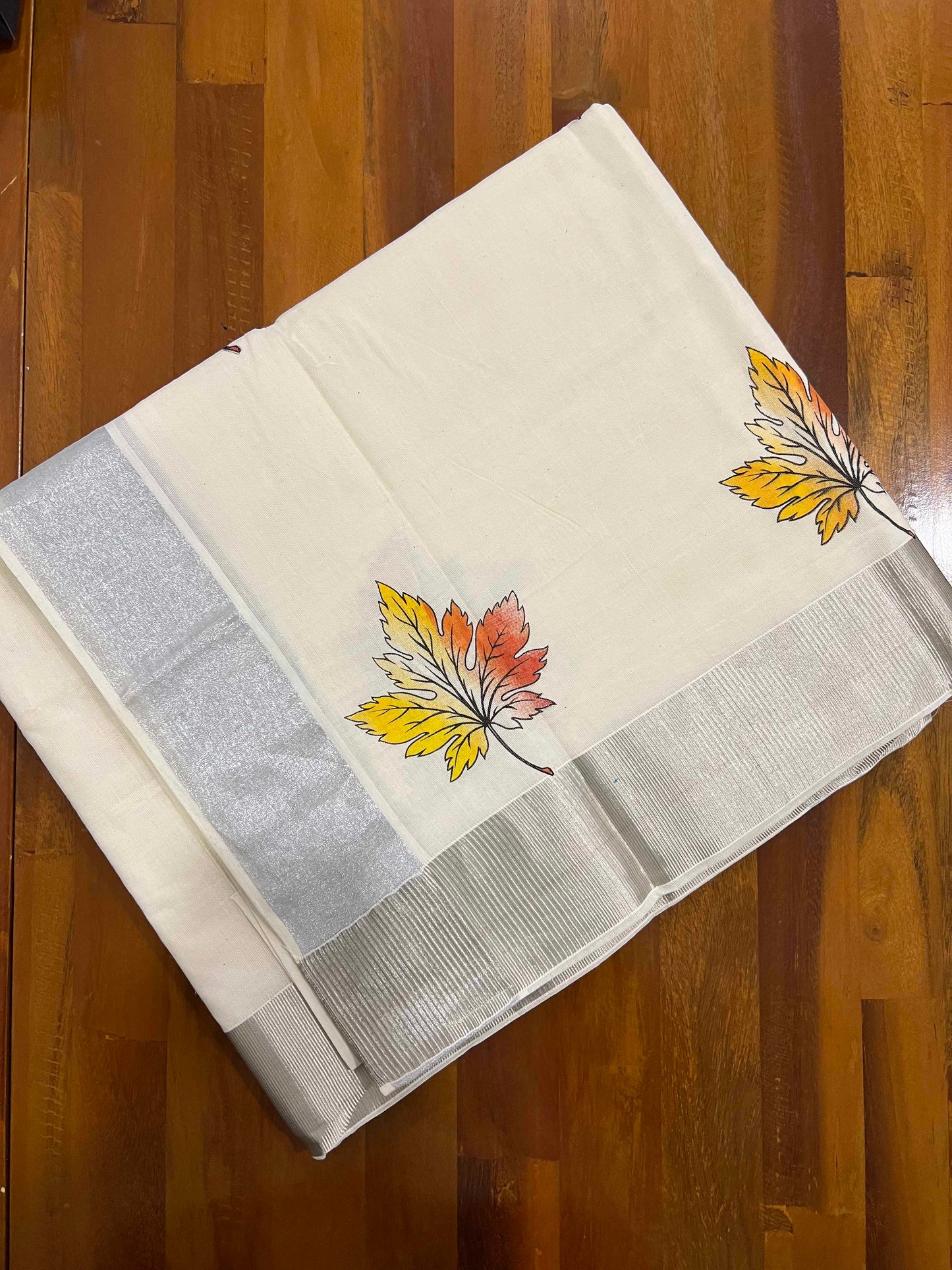 Off White Pure Cotton Kerala Saree with Leaf Mural Prints and Silver Kasavu Border