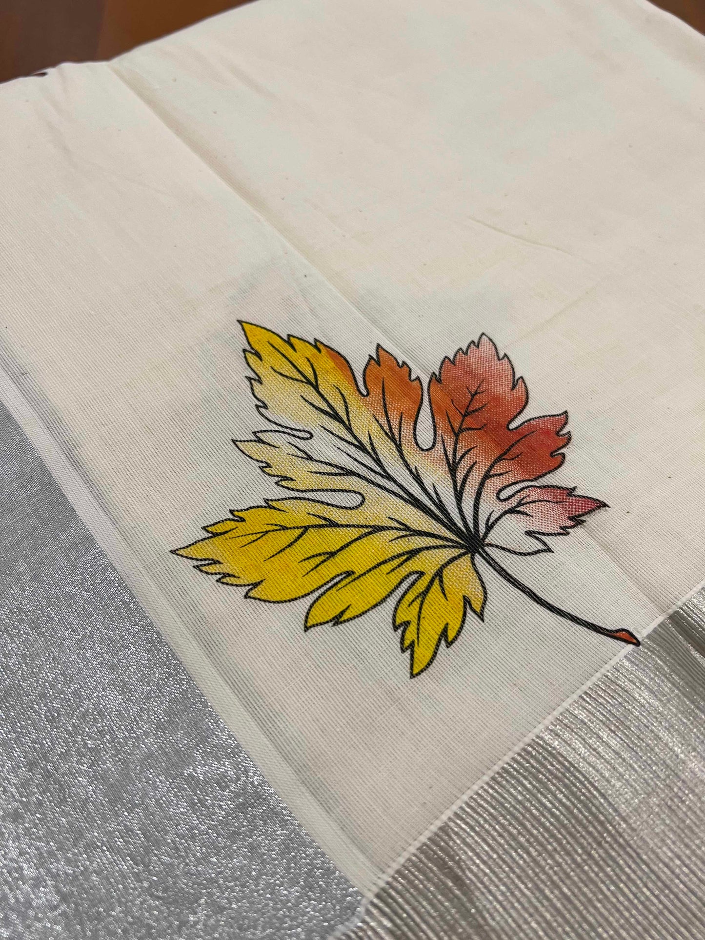 Off White Pure Cotton Kerala Saree with Leaf Mural Prints and Silver Kasavu Border