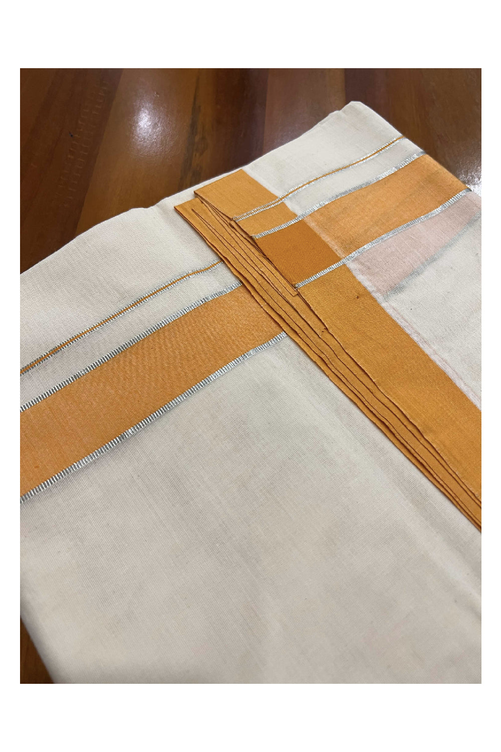 Off White Cotton Mundu with Orange and Silver Kasavu Border (South Indian Dhoti)