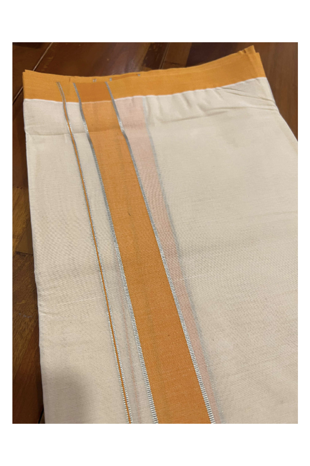 Off White Cotton Mundu with Orange and Silver Kasavu Border (South Indian Dhoti)