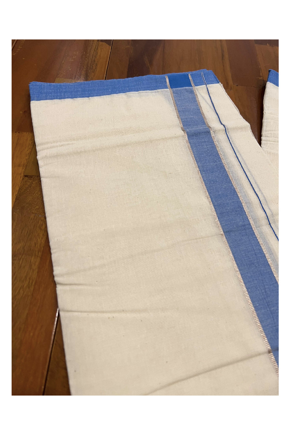 Off White Cotton Mundu with Blue and Silver Kasavu Border (South Indian Dhoti)