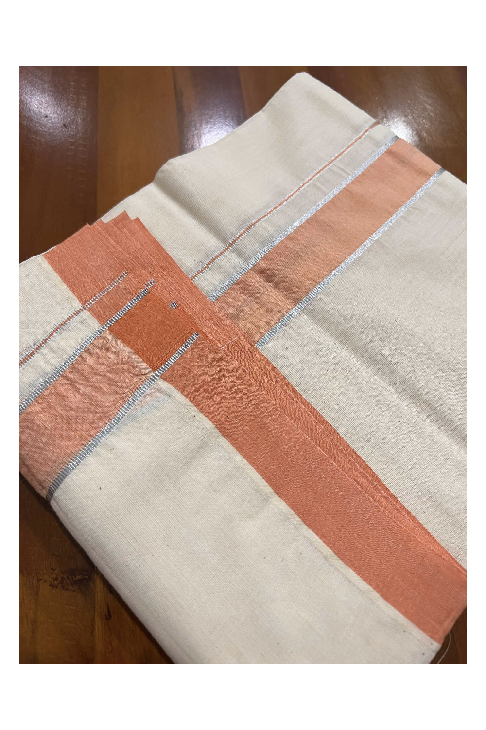 Off White Cotton Mundu with Peach and Silver Kasavu Border (South Indian Dhoti)