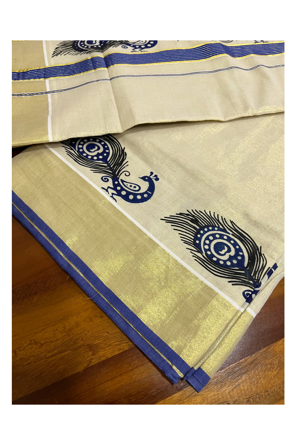 Kerala Tissue Kasavu Saree with Dark Blue Peacock Block Printed Design