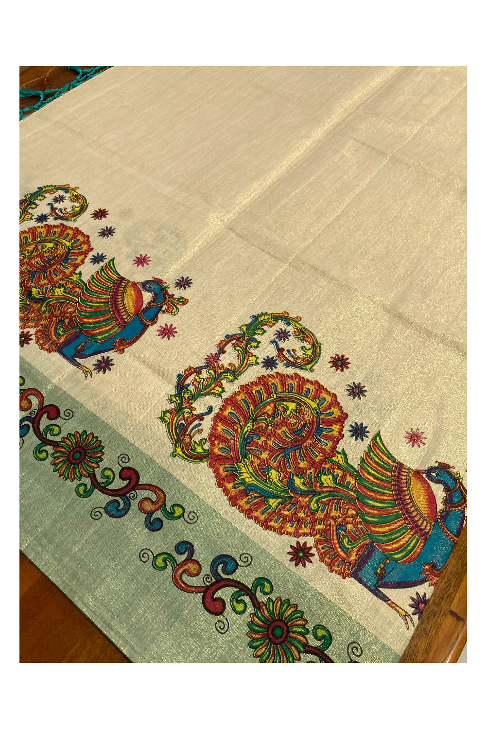 Southloom Onam 2022 Kerala Tissue Kasavu Saree in Turquoise Kara with Peacock Mural Design