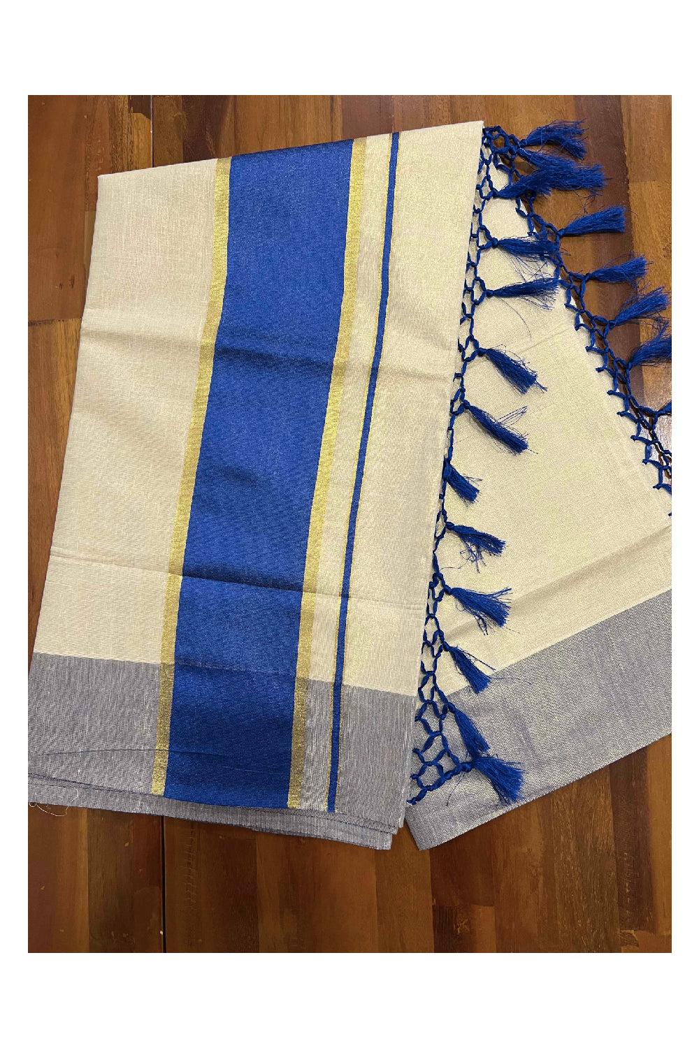 Kerala Kasavu Tissue Saree with Blue Kara and Border with Tassels