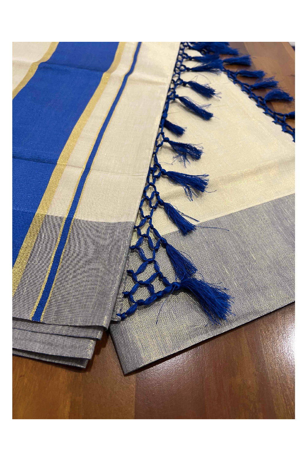 Kerala Kasavu Tissue Saree with Blue Kara and Border with Tassels