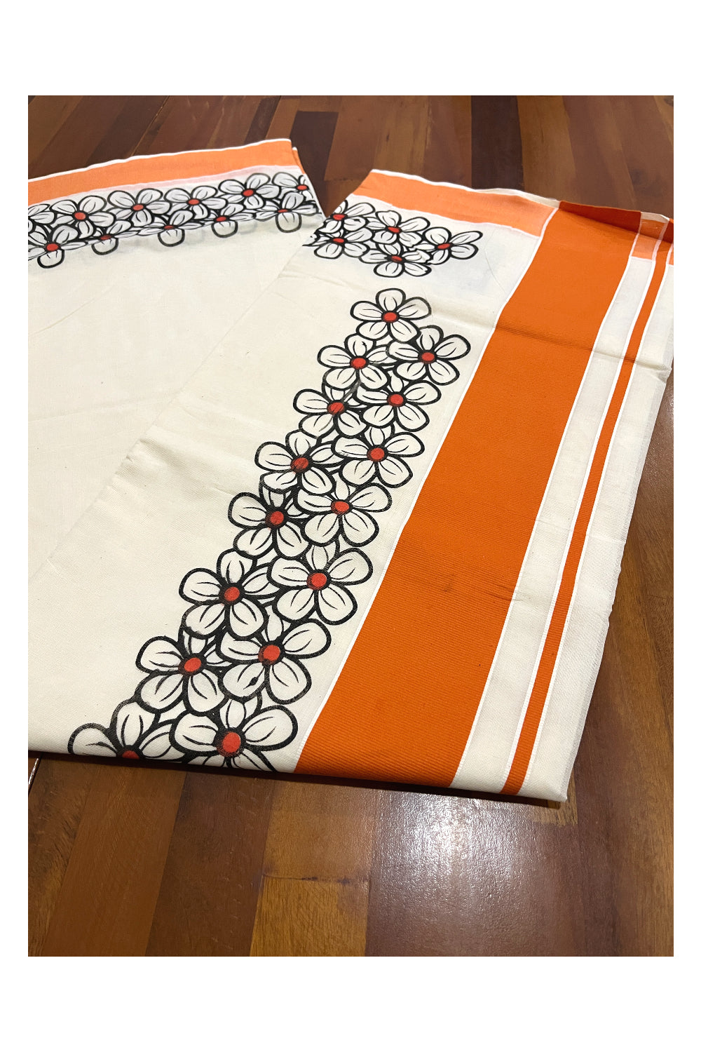 Pure Cotton Kerala Saree with Black Floral Block Prints and Orange Border