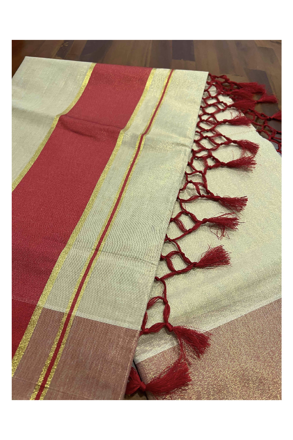 Kerala Kasavu Tissue Saree with Red Kara and Border with Tassels