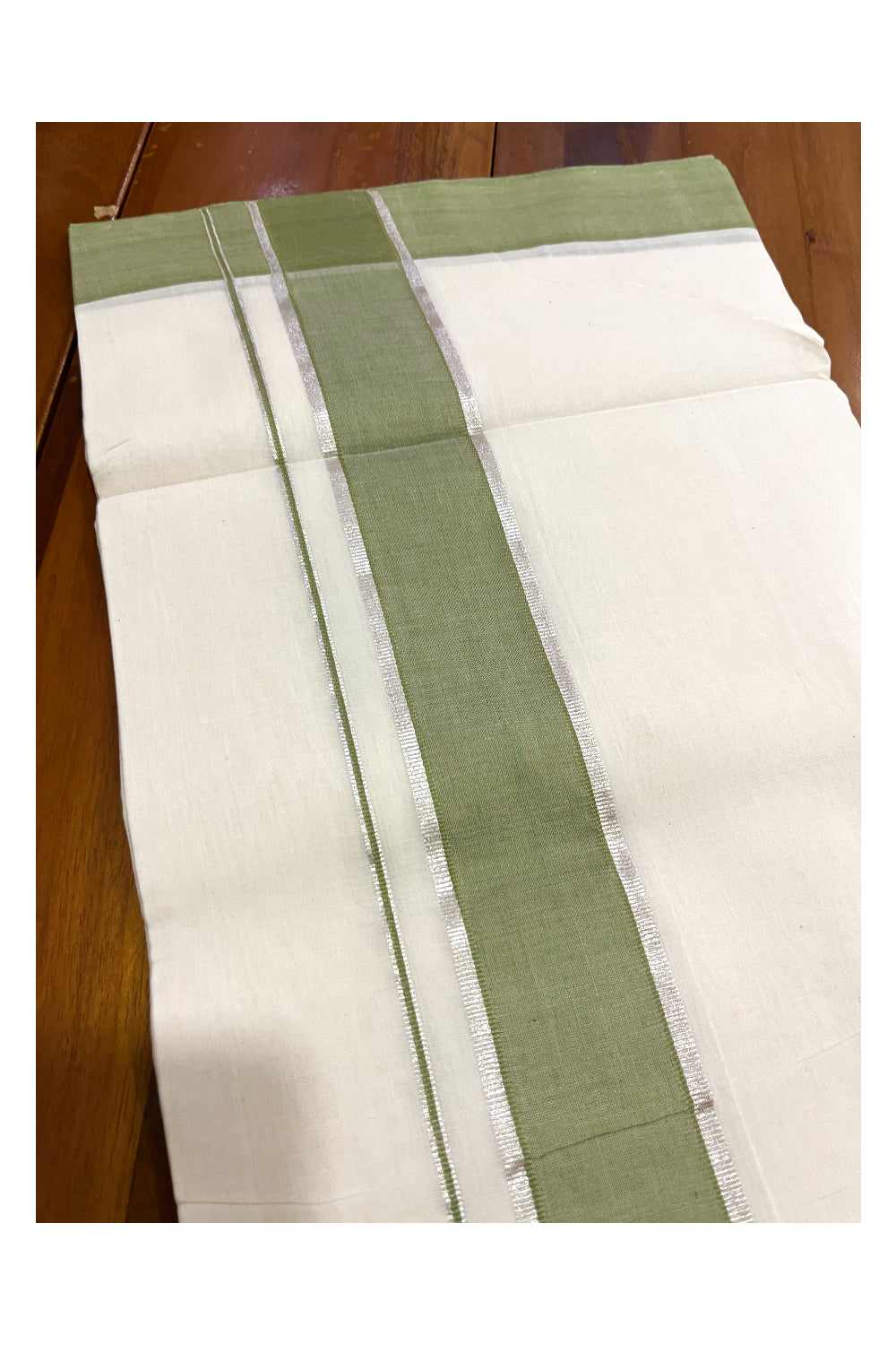 Southloom Premium Unakkupaavu Handloom Mundu with Silver Kasavu and Green Border (South Indian Dhoti)