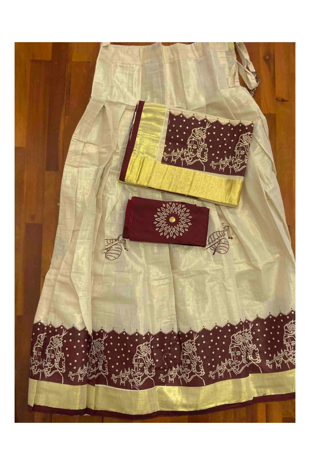 Kerala Tissue Stitched Dhavani Set with Blouse Piece and Neriyathu in with Maroon Accents and Mural Designs