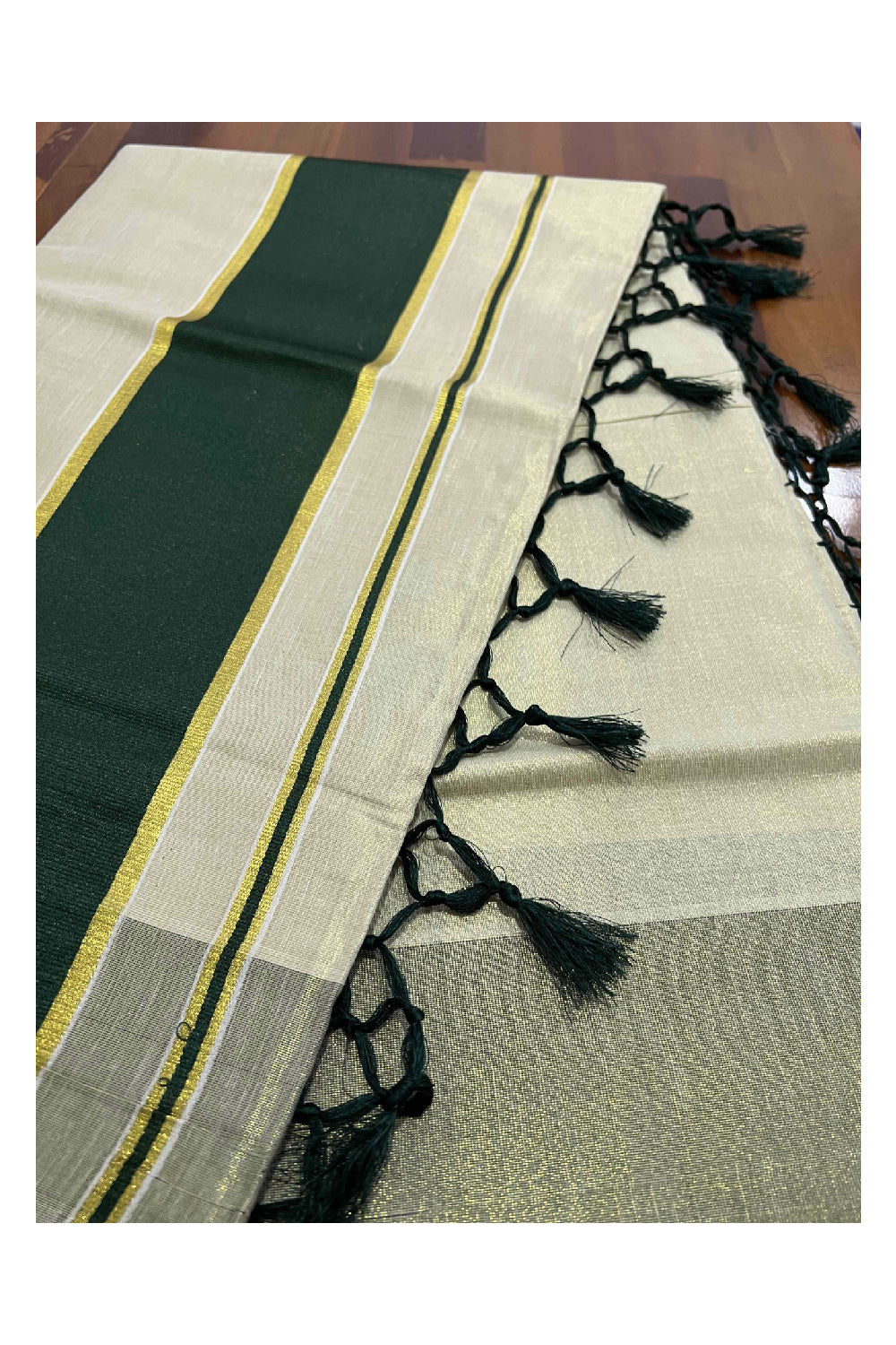 Kerala Kasavu Tissue Saree with Dark Green Kara and Border with Tassels