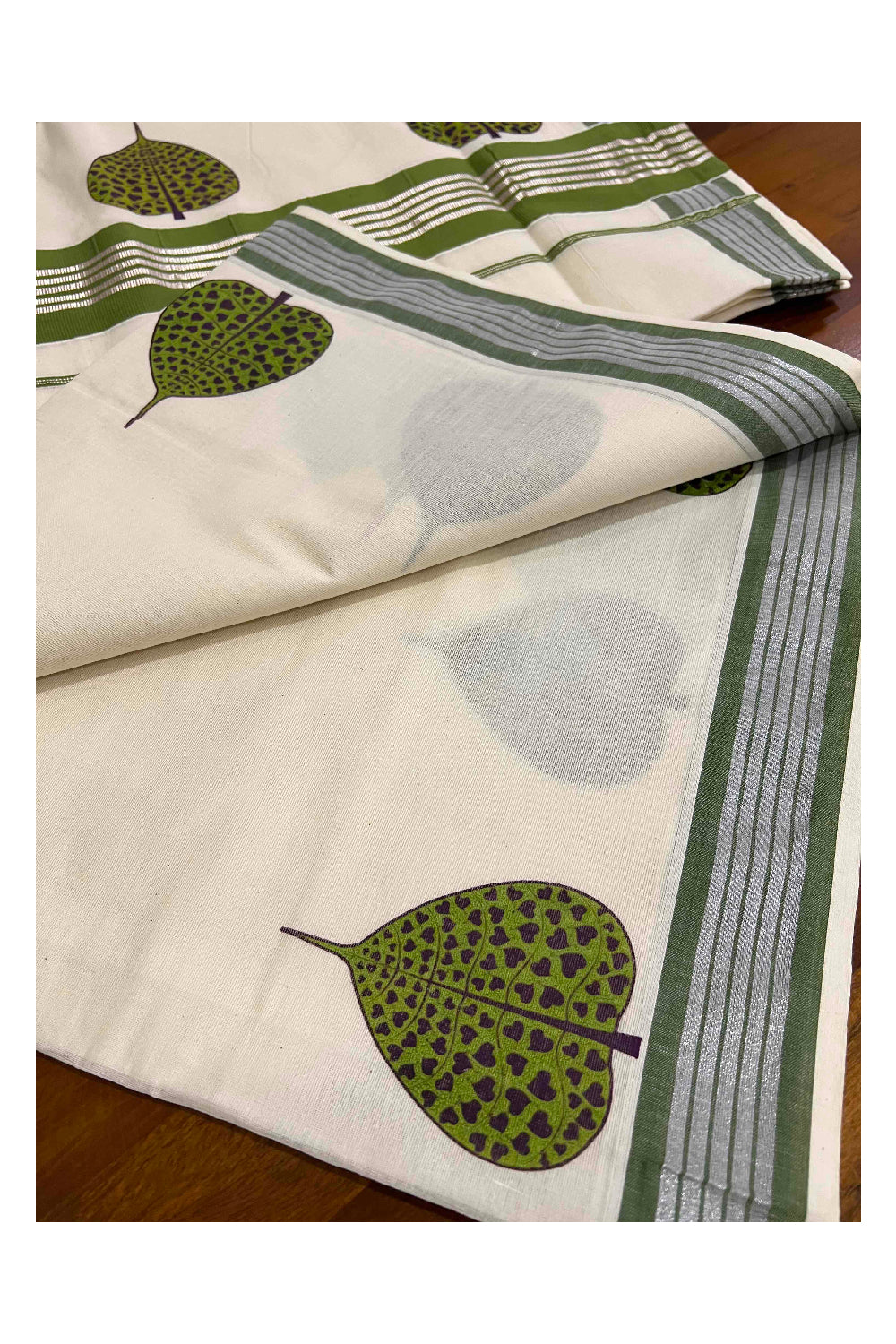 Pure Cotton Kerala Silver Kasavu and Green Border Saree with Mural Leaf Prints